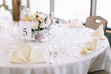 Fine wedding flower table arrangement at reception, pink, white and orange peonies, expensive wedding flowers