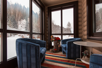 Room in vacation home decorated for the celebration of the new year. Day in winter forest