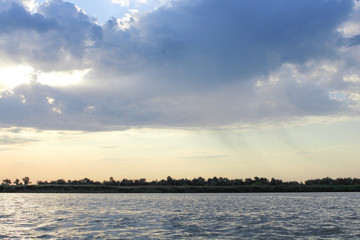 Rain from the clouds over the river