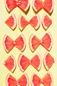 Grapefruit Bowties on Pale Yellow