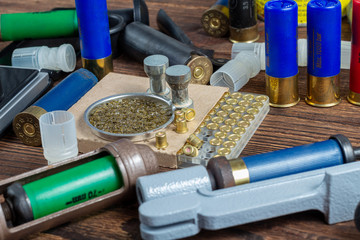 reloading process shotgun shells with special reload equipment. Powder, bullets, fraction, shells,...