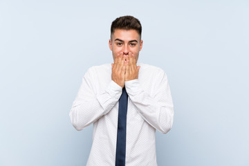 Handsome businessman over isolated blue background with surprise facial expression