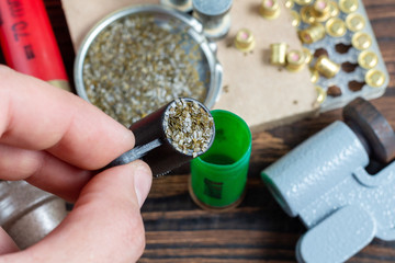 reloading process shotgun shells with special reload equipment. Powder, bullets, fraction, shells,...