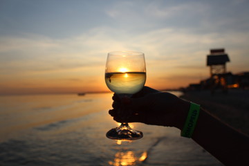 glass of wine at sunset