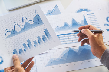 businessman working data document graph chart report marketing research development  planning management strategy analysis financial accounting. Business  office concept.