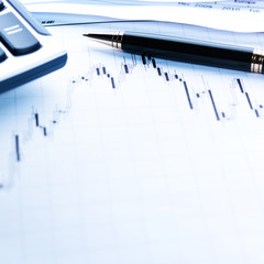 Financial concept. Calculator and pen.