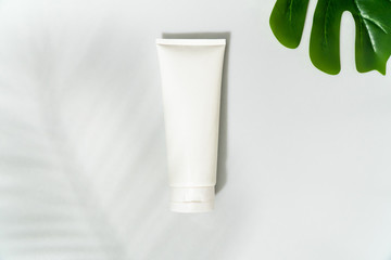 White mock up cleansing face foam on white background with leaf shadow 