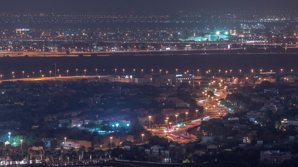 Aerial view of apartment houses and villas in Dubai city night timelapse, United Arab Emirates