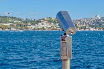 Sightseeing city binoculars operated with coins on the seaside. Bosphorus / Istanbul.