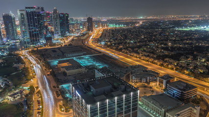 Fototapeta na wymiar Jumeirah Lake Towers residential district aerial night timelapse near Dubai Marina