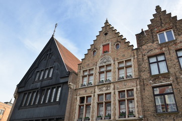 Fototapeta na wymiar Bruges, Belgium. Image with Rozenhoedkaai in Brugge, Dijver river canal twilight and Belfort (Belfry) tower.