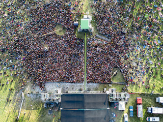 Crowd in front of a stage at a summer music festival