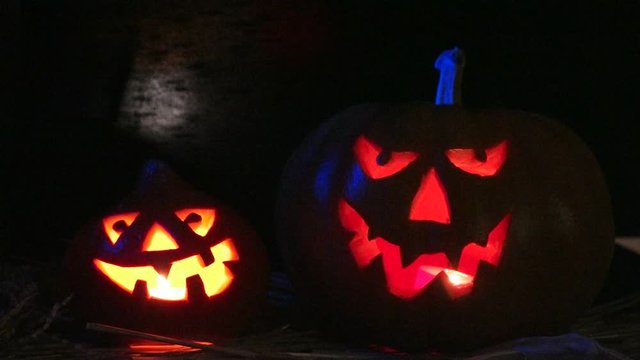 Creepy halloween pumpkin lantern against a black background
