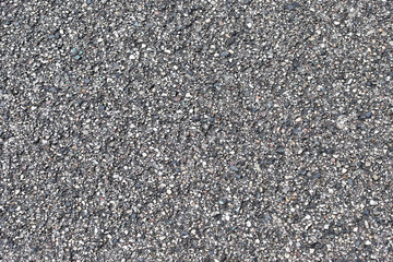 Seamlessly tileable dark asphalt texture. Perfect background with space