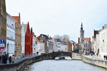 Bruges, Belgium. Image with Rozenhoedkaai in Brugge, Dijver river canal twilight and Belfort (Belfry) tower.