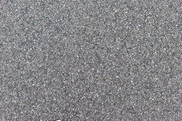 Seamlessly tileable dark asphalt texture. Perfect background with space