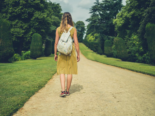 Young woman walking on path in a park