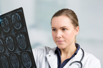 young doctor is examining an x-ray image