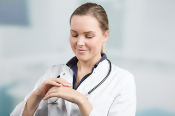 young female doctor is applying protective hand cream