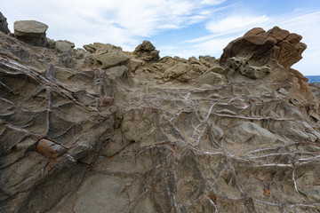 Natural volcanic stone texture. Rock texture with metal elements (Selective focus)