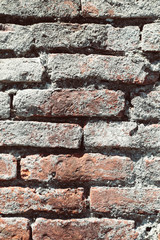 Brick wall with cracked stones, 