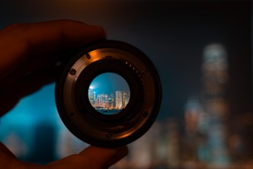 Hong kong night view through camera lens. Photography and travel concept. - obrazy, fototapety, plakaty