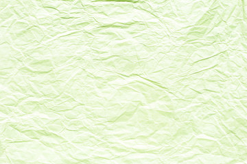 Old crumpled lime green paper background texture