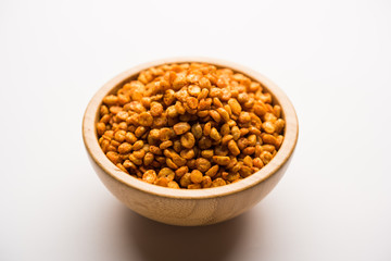 Fried and Spicy Chana Dal Masala is a popular Chakna recipe. served in a bowl. selective focus