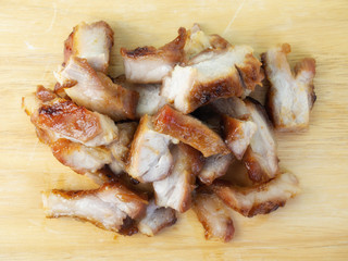 grilled pork chop on wooden board.