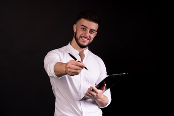 Business man give a pen to his partner signing a contract. Happiness and approval.