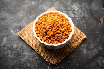 Fried and Spicy Chana Dal Masala is a popular Chakna recipe. served in a bowl. selective focus