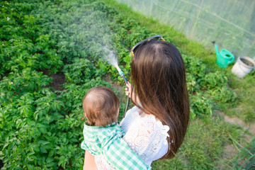 mom and son hose home crops. eco food. without additives. healthy food for the baby.