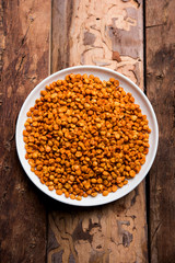 Fried and Spicy Chana Dal Masala is a popular Chakna recipe. served in a bowl. selective focus