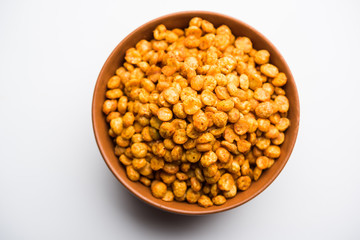 Fried and Spicy Chana Dal Masala is a popular Chakna recipe. served in a bowl. selective focus