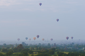 Hot-Air Balloons and Pagodas at misty Old Bagan, Myanmar