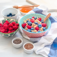 breakfast buckwheat porridge with raspberries and blueberries, good morning concept
