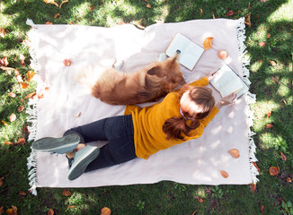 girl and dog on a lawn
