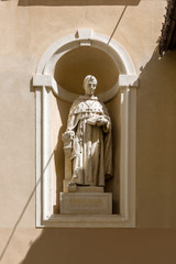 Sculpture of a medieval theologian, St. Bonaventure (Giovanni Fidanza) on the facade of St. Nicholas Cathedral in Ljubljana