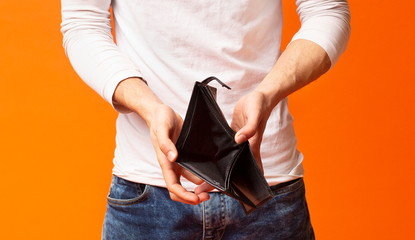 Empty wallet in hands of unemployed black man