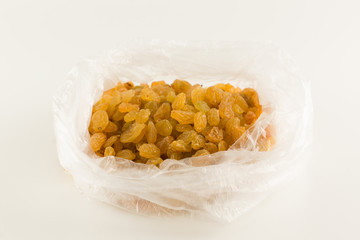 Fresh picked raisins isolated on white background