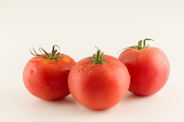 ripe red varietal tomatoes isolated