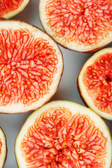 Figs are ripe. Creative diagram of chopped figs on a white background in the form of a texture inscribed in a rectangle.