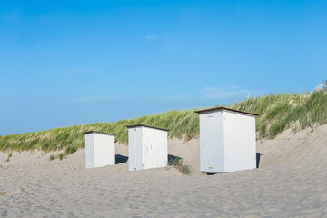 row of wooden beach huts on day noon light , Image for summer vacation concept 