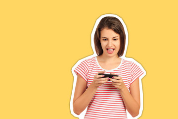 Portrait of a cheerful young woman using a mobile phone playing a game on the network. emotional girl Magazine collage style with trendy color
