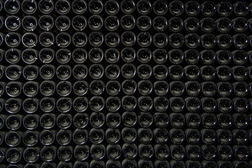 Big stock of wine bottles laying in wine cellar, Bordeaux winery, France