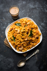 Cornflake Chivda or Corn Chiwda loaded with peanuts and Cashew. Served in a bowl. selective focus
