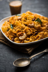 Cornflake Chivda or Corn Chiwda loaded with peanuts and Cashew. Served in a bowl. selective focus