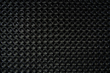 Big stock of wine bottles laying in wine cellar, Bordeaux winery, France