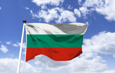 Fototapeta na wymiar Bulgaria flag mockup floating in the blue sky. The white and red colors originate from the Russian flag; green means development as an agricultural country after its independence.