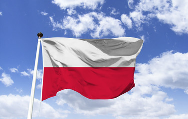 Fototapeta na wymiar Poland flag mockup fluttering in the wind under blue sky. Eastern European country on the Baltic Sea coast. In Krakow, Cloth Hall, Wawel Castle. Capital: Warsaw.